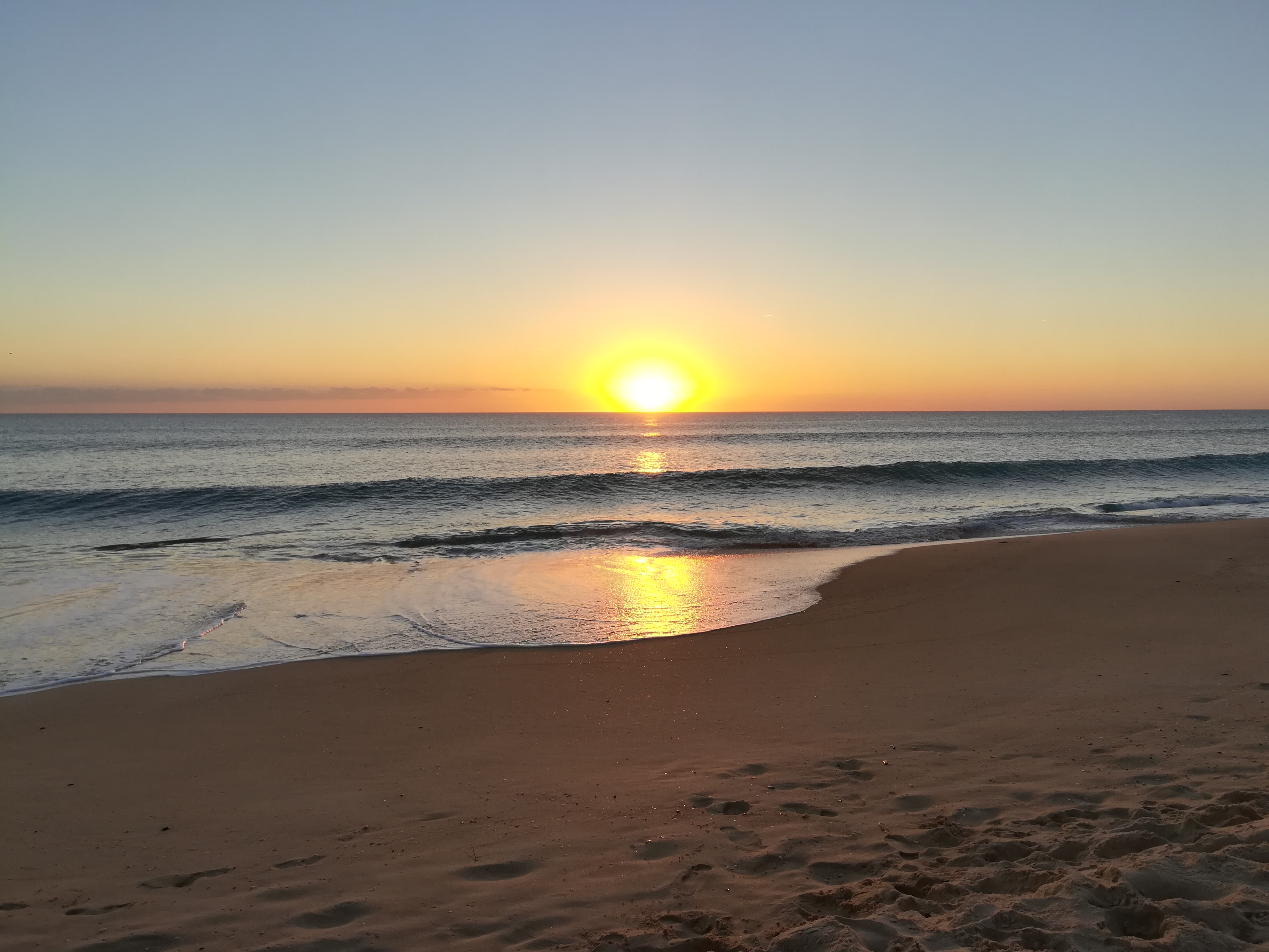 Sunset on beach in Faro, Portugal